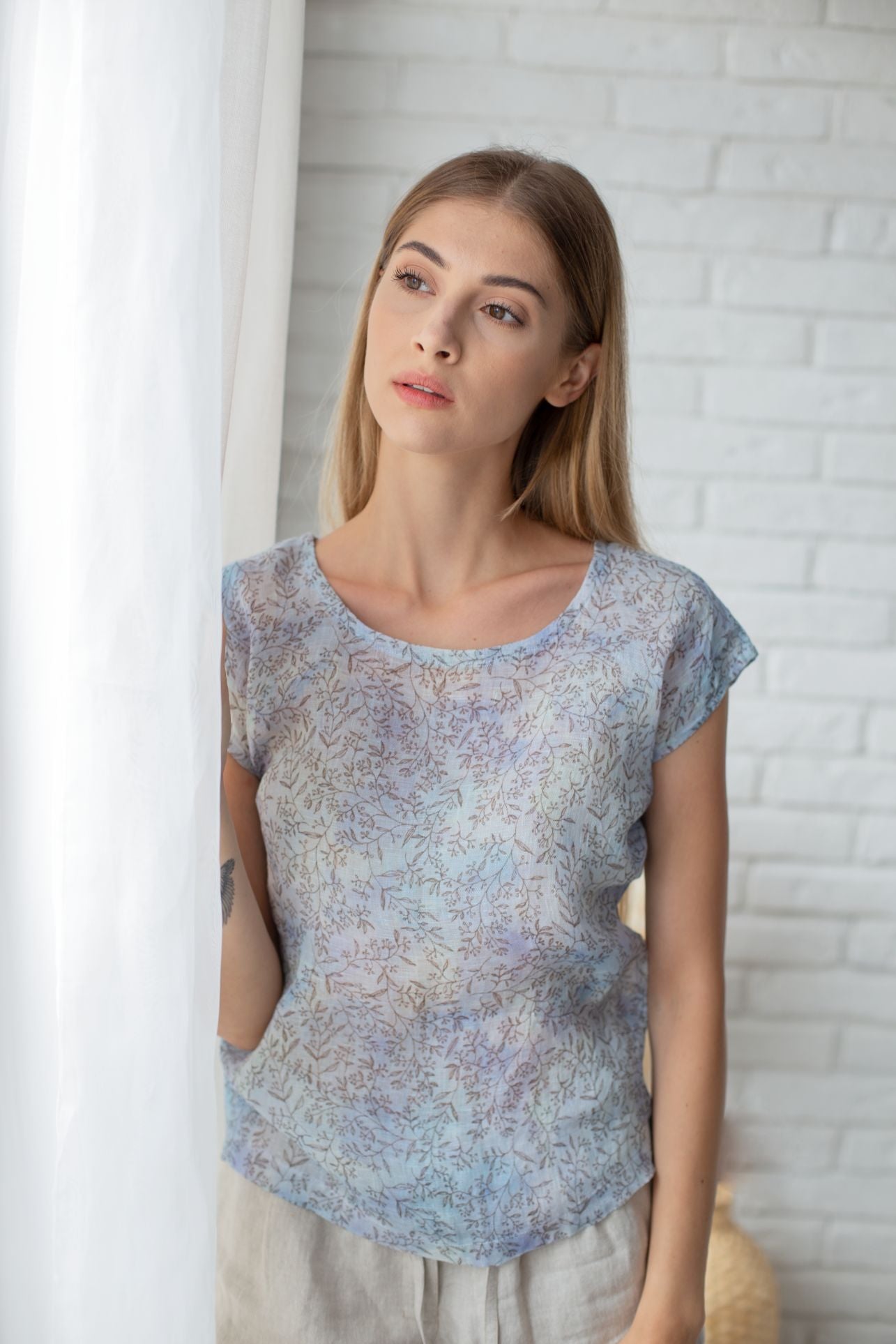 0340 - light blue top with a floral print